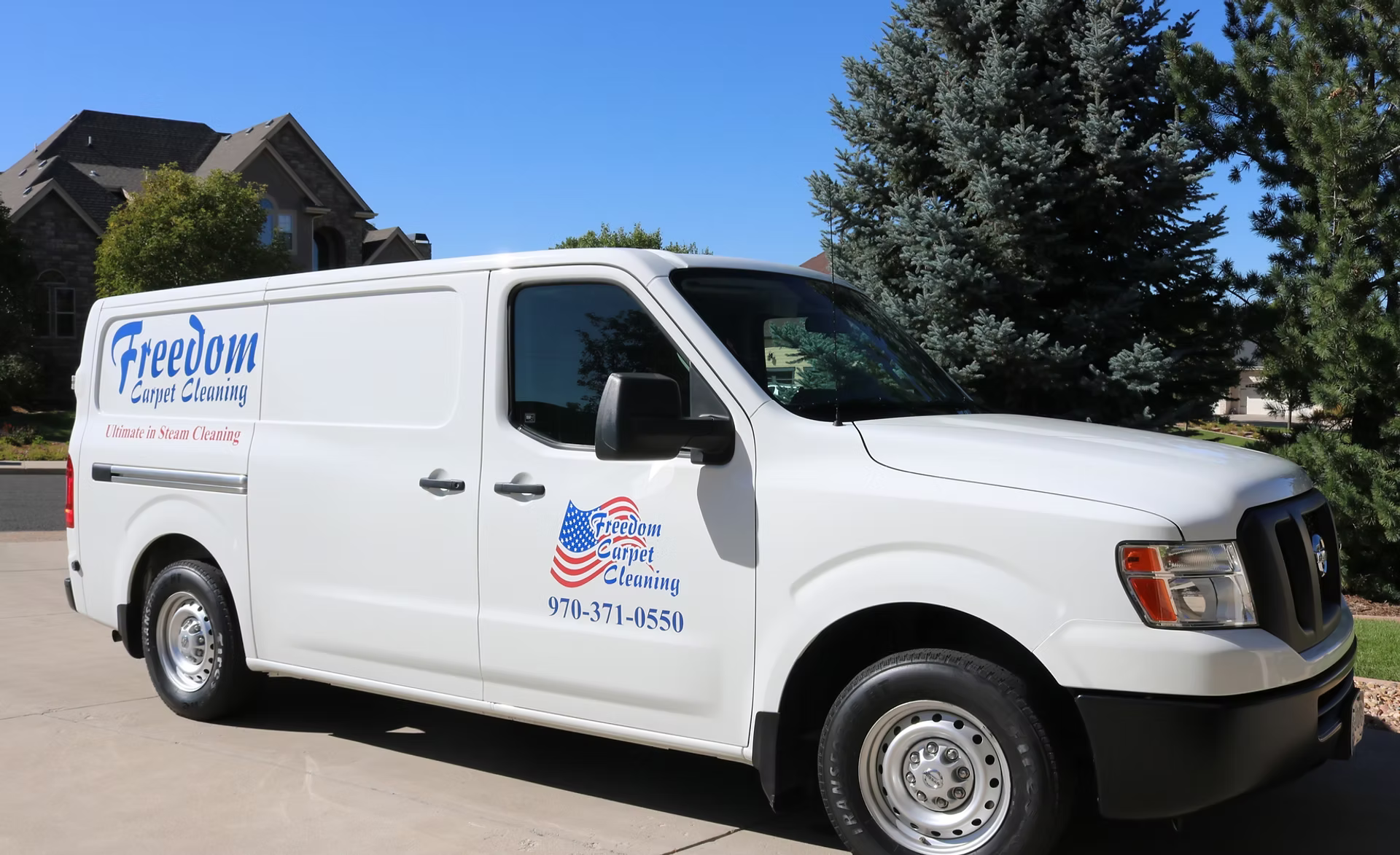 Freedom Carpet Cleaning service van with the company logo and phone number